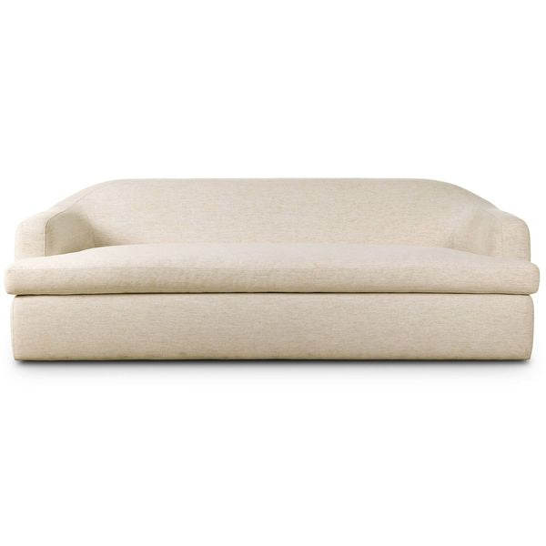 Sofa tapicerowana o prostej sylwetce z delikatnym akcentem w odcieniu bieli