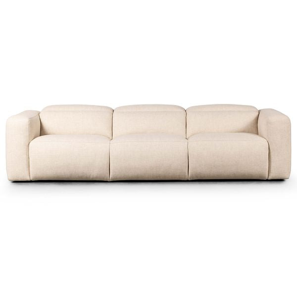 Sofa tapicerowana o zaokraglonej formie z prostym detalem w odcieniu bieli