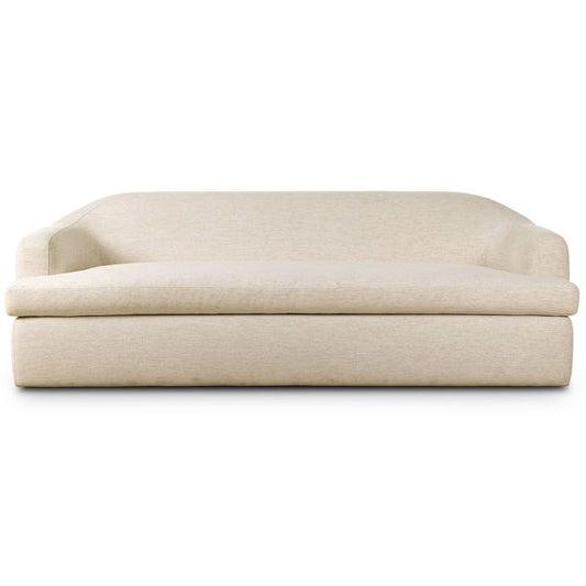 Sofa tapicerowana o prostej sylwetce z delikatnym akcentem w odcieniu bieli