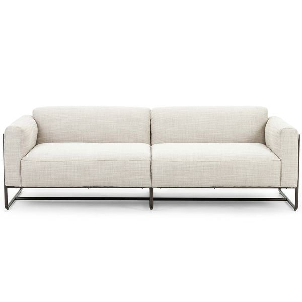 Sofa tapicerowana o wyrazistej formie z eleganckim profilem w odcieniu bieli