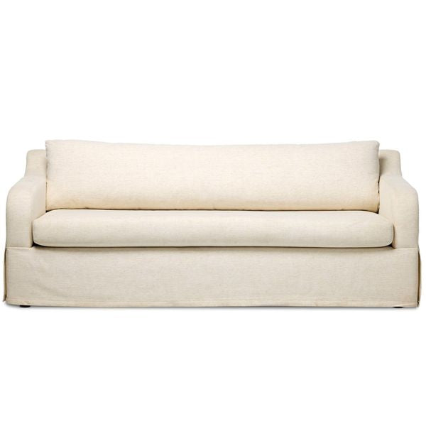 Sofa tapicerowana o zaokraglonej formie z agodnym konturem w odcieniu bieli
