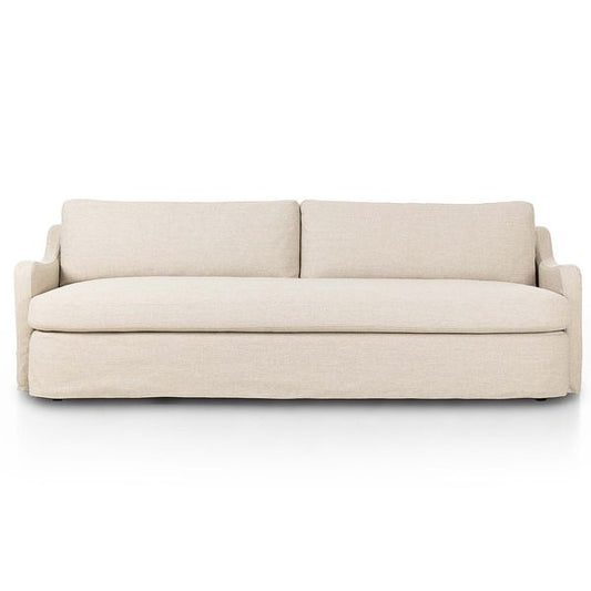 Sofa tapicerowana o spokojnej linii z agodnym konturem w odcieniu bieli